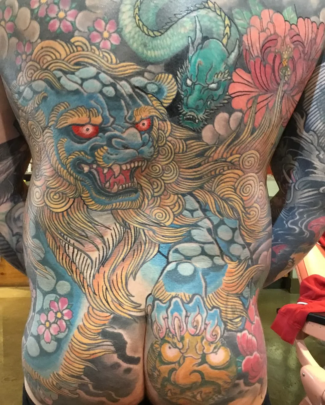 Lion and Dragon — Japanese tattoo by Erik Payne at Inkvision Tattoo in Boise, Idaho