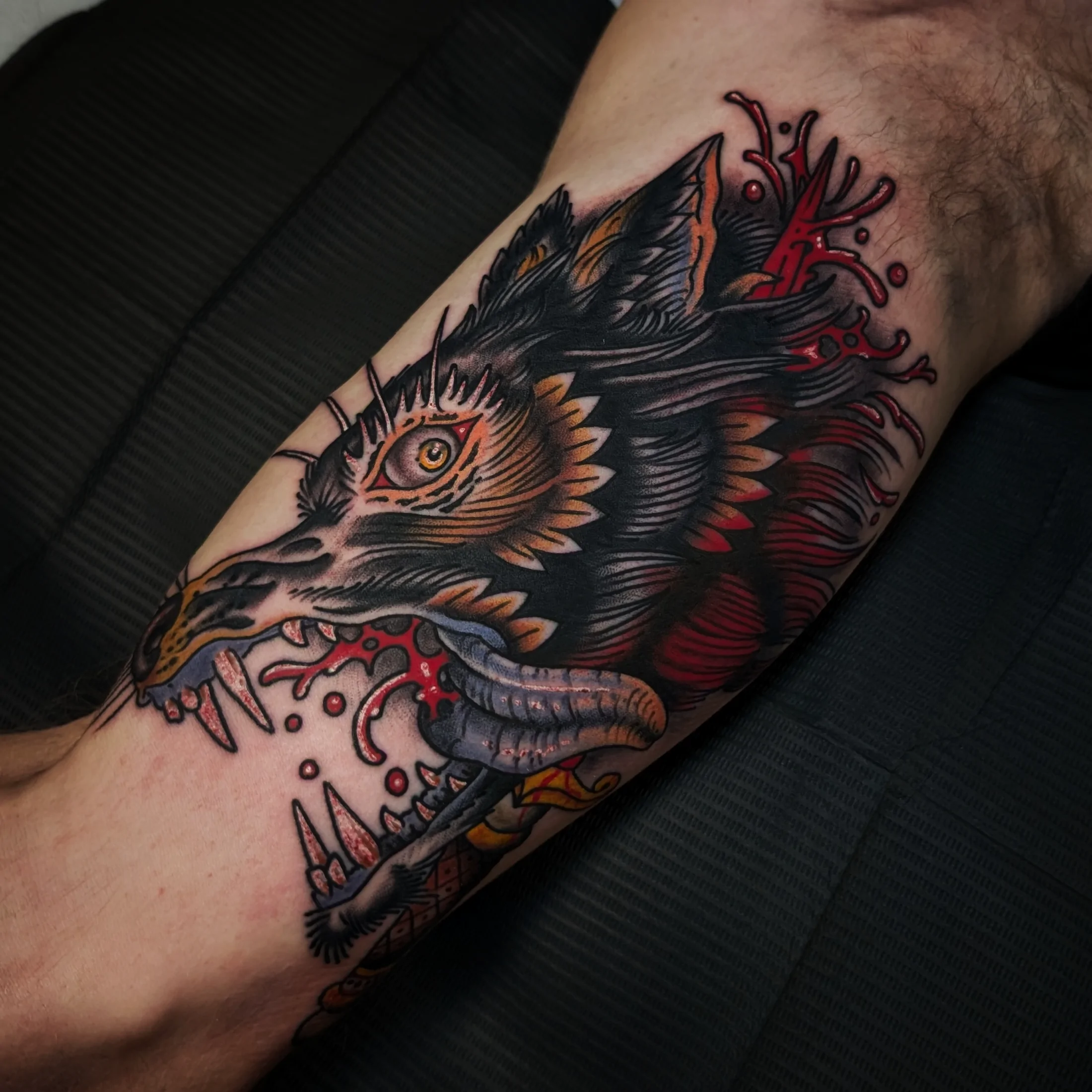 Black Dog and Roses — Traditional tattoo by Daniel Gerbis at Inkvision Tattoo in Boise, Idaho